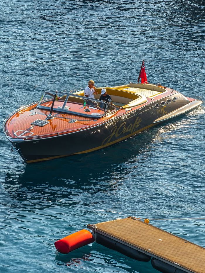 Elegant speedboat cruising in the pristine blue waters of Göcek, Muğla, Turkey on a sunny day.